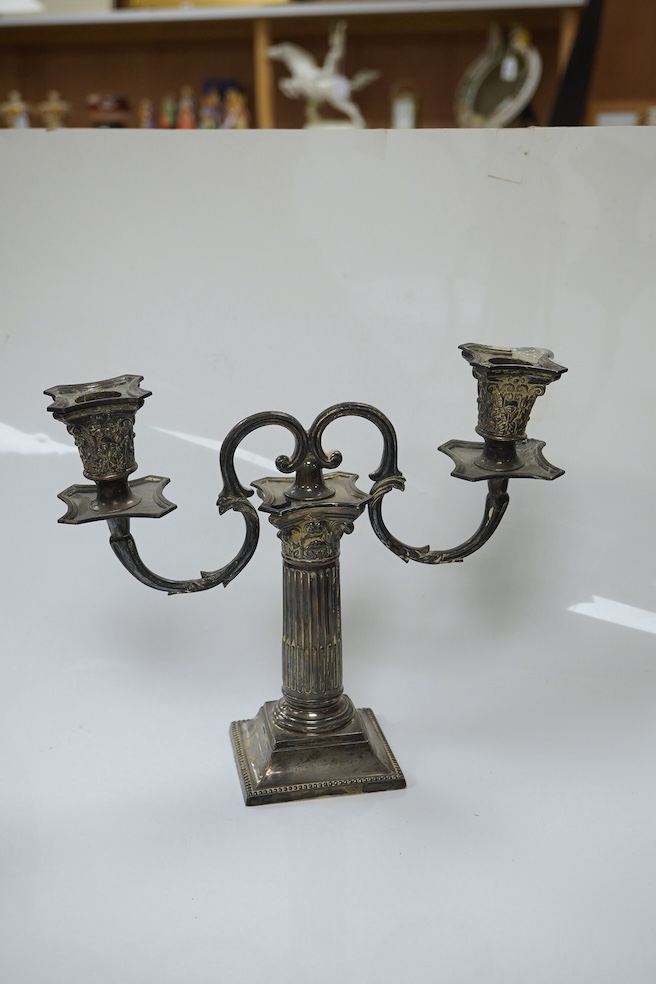 A pair of late Victorian Corinthian column dwarf candlesticks, by Martin, Hall & Co, London, 1894, 14.7cm, weighted, together with a pair of associated silver plated candelabra arms. Condition - poor to fair